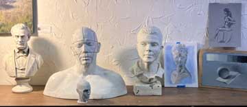 Setup of plaster cast human busts used for academic drawing